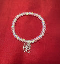 Pulsera elástica para adultos en cristal transparente y dije de amor con huellita